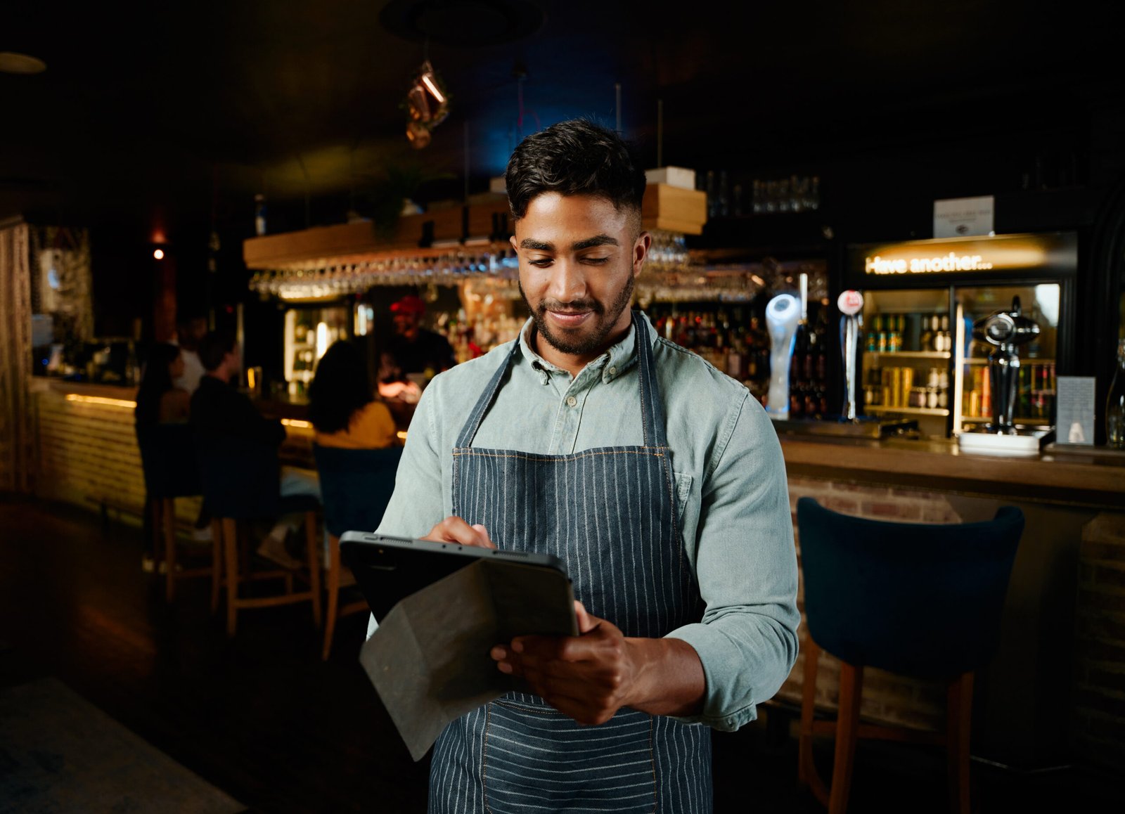 Retailer using phone in shop